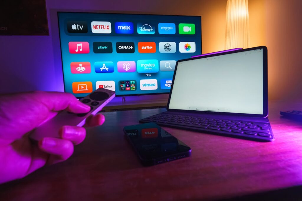 A cozy home setup featuring streaming services on smart TV, tablet, and smartphone.